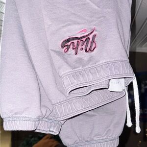 Gray Nike Sweatpants with Pink and black Logo